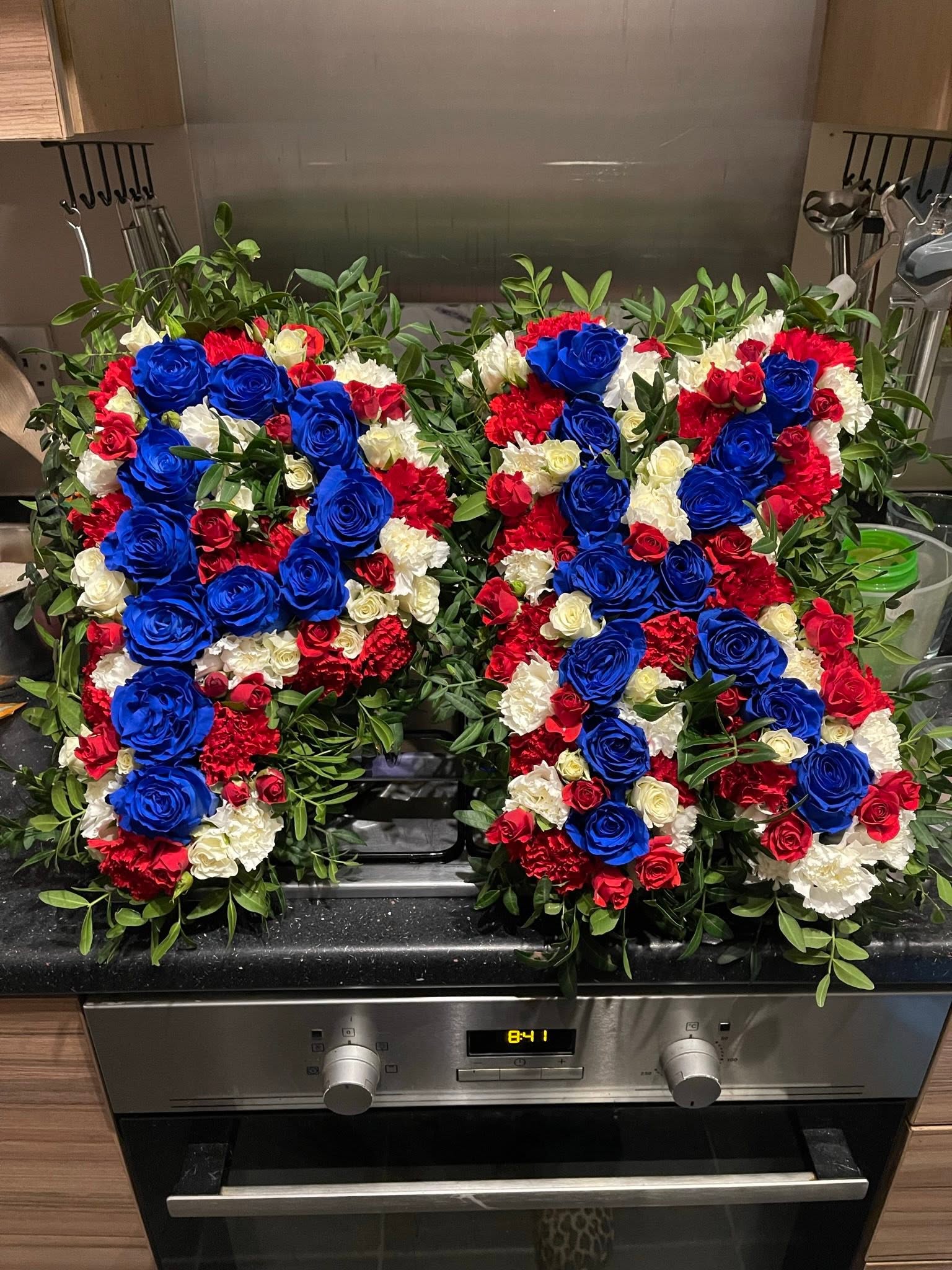 Red, white and blue rose initials tribute